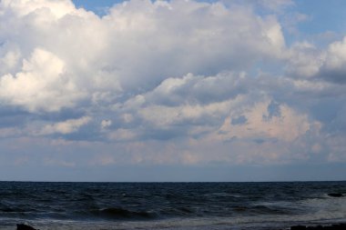 Rain clouds in the sky over the Mediterranean Sea. 
