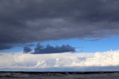 Rain clouds in the sky over the Mediterranean Sea. 