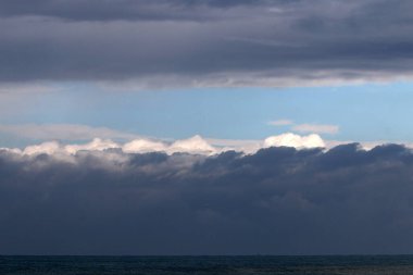 Rain clouds in the sky over the Mediterranean Sea. 