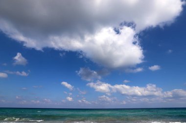 Rain clouds in the sky over the Mediterranean Sea. 