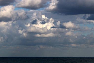 Rain clouds in the sky over the Mediterranean Sea. 