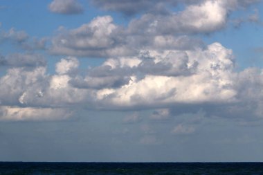 Rain clouds in the sky over the Mediterranean Sea. 