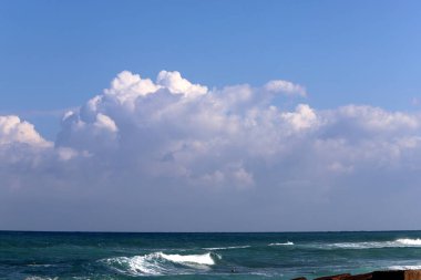 Rain clouds in the sky over the Mediterranean Sea. 