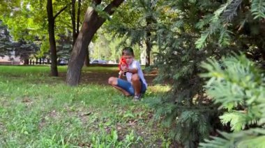 A boy playing with his nerf gun at the park. 