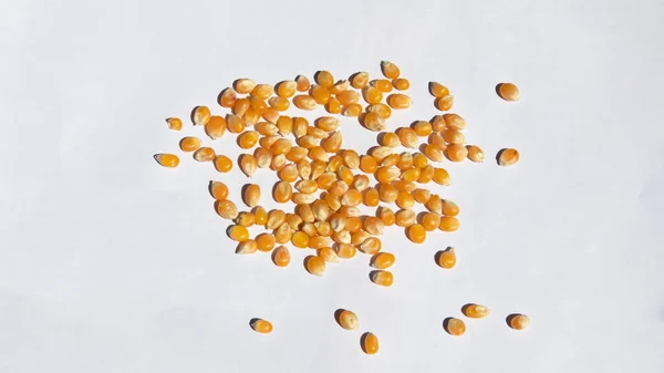 scattered popcorn kernels and shadows