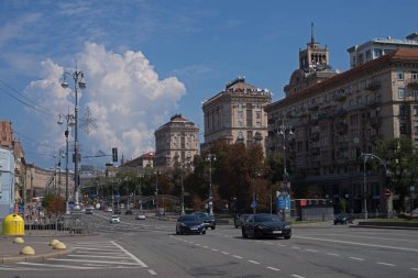 Taras Shevchenko University and a monument hidden from a missile strike and Khreshchatyk Street today.