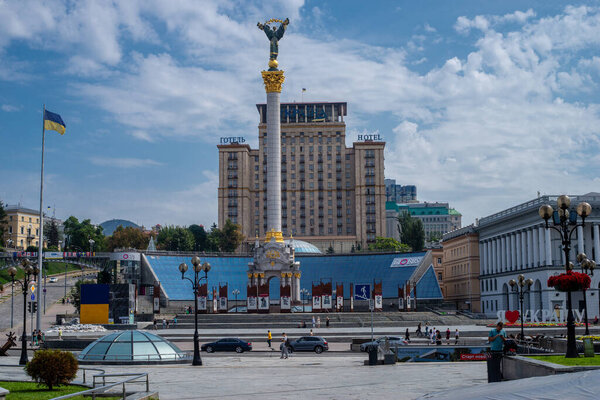 "Kiev, Kiev region Ukraine - 08.13.2022 :Center of Kiev. Maidan Nezalezhnosti.Andriyivsky descent.Monuments covered with a bag from shell hits. Panoramic view of the left bank of Kiev".