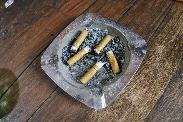 Ashtray Full Cigarette Butts Wooden Table Remember Smoking Kills You — Stockfoto