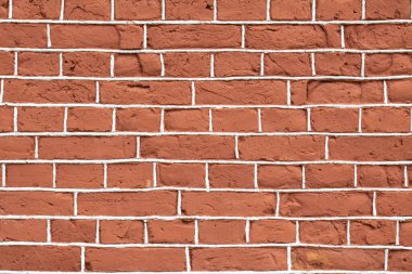 Beyaz dikişli kırmızı retro tuğla duvarı.