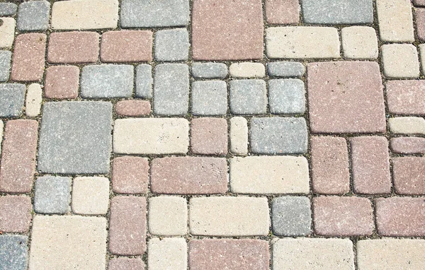 texture of colorful stone blocks on the sidewalk.