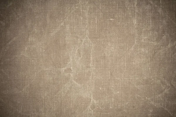texture from an old green tarpaulin with traces of wear.