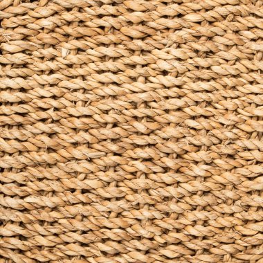 embossed background of large-weave rattan stems.