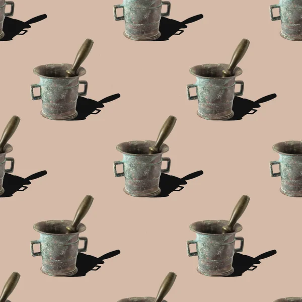 pattern from a bronze mortar with a pestle on a beige background.