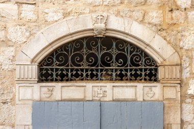 Bethlehem, Israel, December 25, 2021 : Christian symbols carved into the stone above the entrance to the house on Star Street in Bethlehem in the Palestinian Authority, Israel
