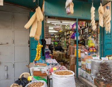 Bethlehem, Israel, December 25, 2021 : Small street shop selling sweets, tobacco and household items on Nativity Street in Bethlehem in the Palestinian Authority, Israel