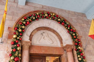 Bethlehem, Israel, December 25, 2021 : Entrance to the St. Marys Syriac Orthodox Church decorated for the celebration of Christmas in Bethlehem in the Palestinian Authority, Israel