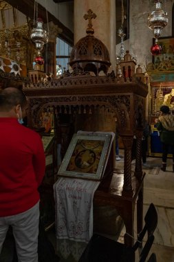 Bethlehem, Israel, December 25, 2021 : The stand with icons in the side hall of the Church of Nativity in Bethlehem in the Palestinian Authority, Israel