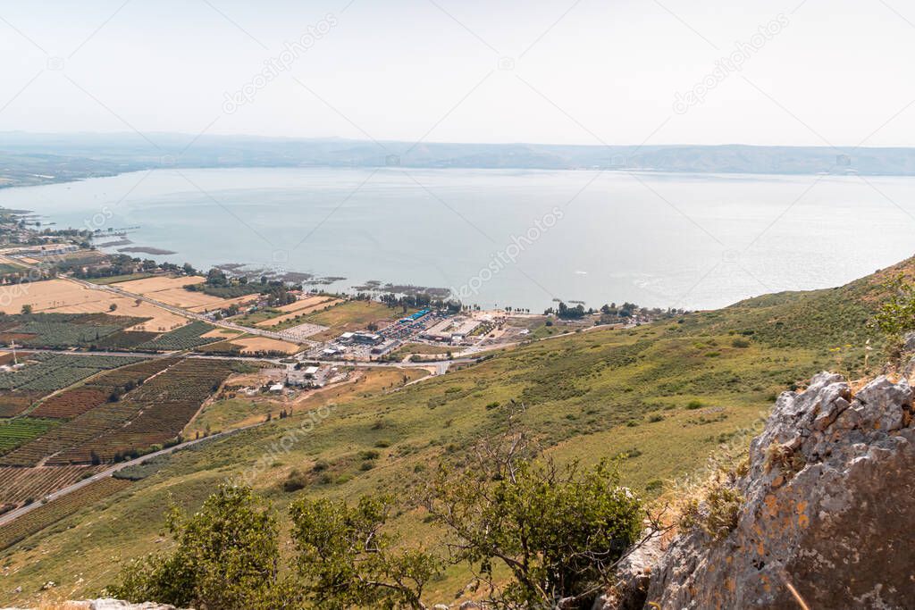 View from Mount Arbel to the adjacent valley and villages on the coast of Lake Kinneret - the Sea of Galilee, near the city of Tiberias, in northern Israel