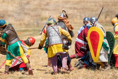 Tiberias, Israel, July 01, 2022 : Participants in the reconstruction of Horns of Hattin battle in 1187 participate in the battle on the battlefield near Tiberias, Israel
