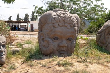 Haifa, Israel, August 20, 2022 : Stone exhibit in the Dagan Shklovsky Sculpture Park - Psalm Garden, in Ein Carmel, northern Israel