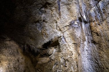 A cave with stalagmites and stalactites in which a caveman lived in a national reserve - Nahal Mearot Nature Preserve, near Haifa, in northern Israel