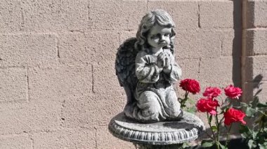 figurine of a praying child