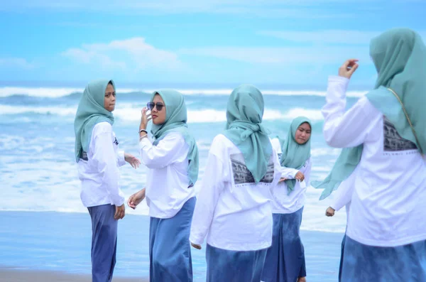 people on vacation at the beach, parangtritis yogyakarta, 18 maret 2022