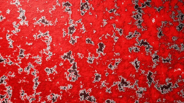 3D rendering. Red metallic texture with wear spots. Red paint on metal sheet. Rust on painted metal. Abstract gray spots on a red background. Worn red metal.