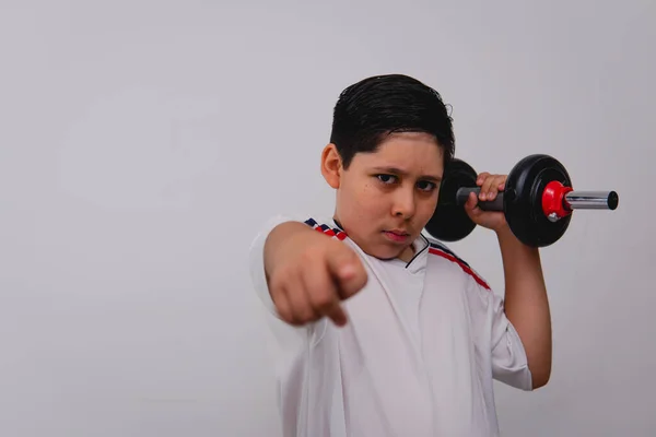 Boy Dressed White Sports Shirt Carrying Black Dumbbell Pointing Camera — Stockfoto