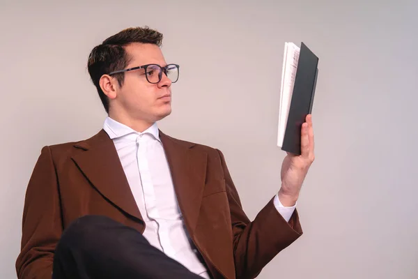 University Professor Isolated White Background Sitting Attentively Reading Book Elegant — Stockfoto