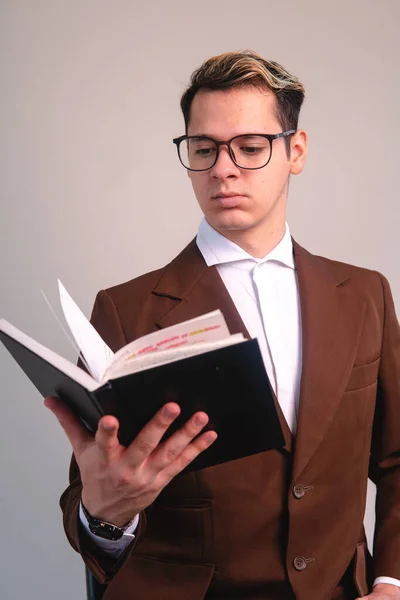 Businessman Black Notepad His Hand Elegant Man Suit Jacket Glasses — Stockfoto