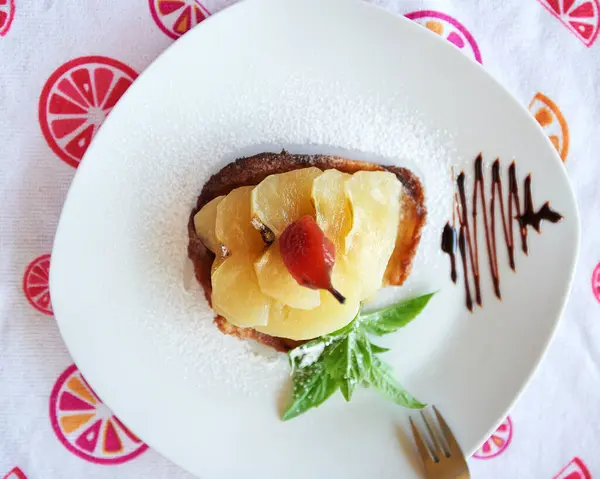 Morning breakfast tortilla with fruits baked pear and apples and tea meal