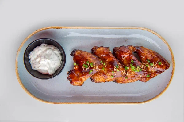 Grilled chicken wings with cumin seeds