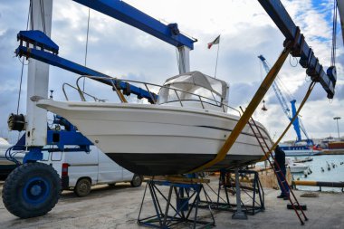 Parking of ships and yachts repair dry dock in Italy on the coast of Sicily