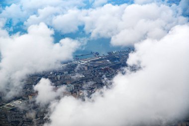 Top view through the clouds on the city of Baku from a bird's eye view