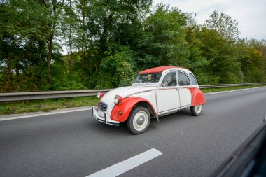 The legendary beetle Citroen retro car is a very rare car on the highway in Belgium, everyone admires this beauty of this masterpiece