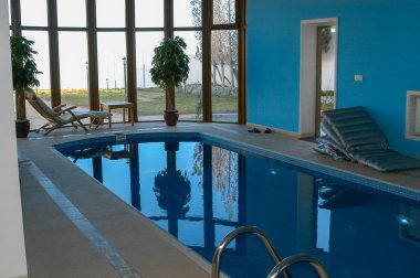 Our house is a view of the pool inside the house with a panorama of the city a beautiful view