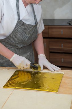 Confectioner chef coocking for baking sweets  and pizza hands working moment