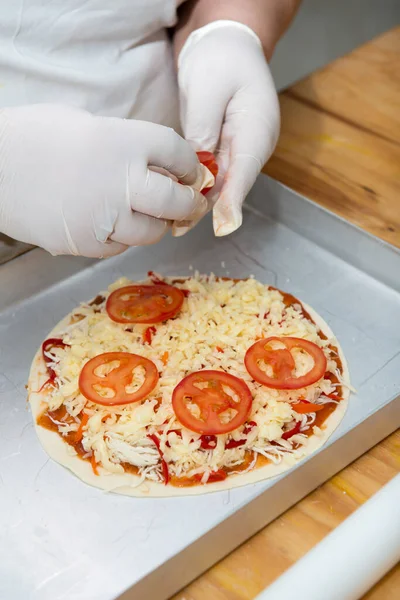 Confectioner chef coocking for baking sweets  and pizza hands working moment