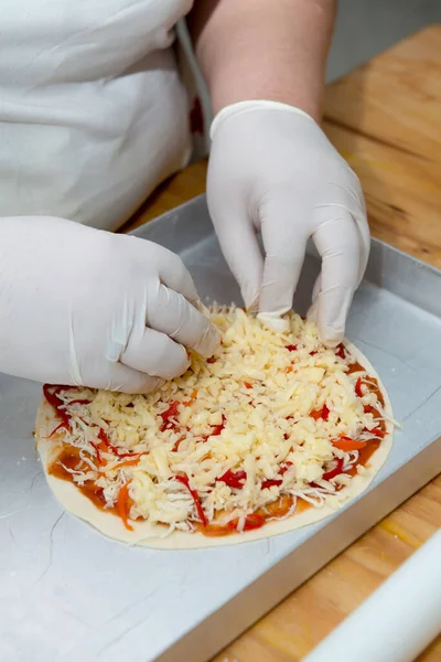 Confectioner chef cooking for baking sweets  and pizza hands working moment