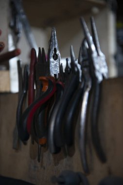 weapons workshop work environment weapons restoration supplies pliers tools