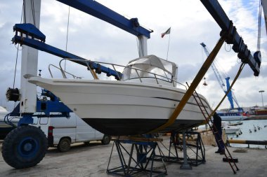 Parking of ships and yachts repair dry dock in Italy on the coast of Sicil