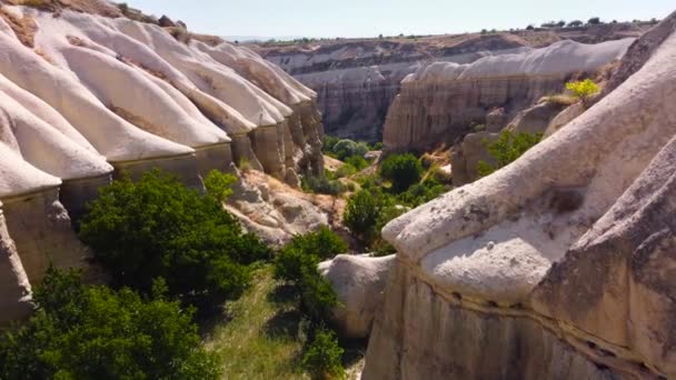 Unusual Mountains landscape in Cappadocia Turkey, Birds eye view 4k aerial drone. White Rocks, Dramatic geological wonder. Beautiful background and unusual landscape — Stock Video