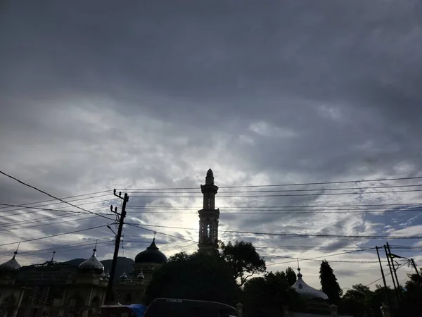 Silhouette Minarets Power Lines Cloudy Sky — Stock fotografie