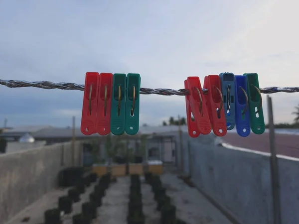 clothesline clamp hanging on a clothesline