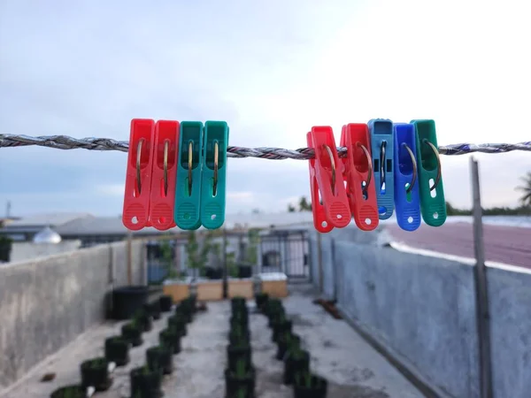 clothesline clamp hanging on a clothesline