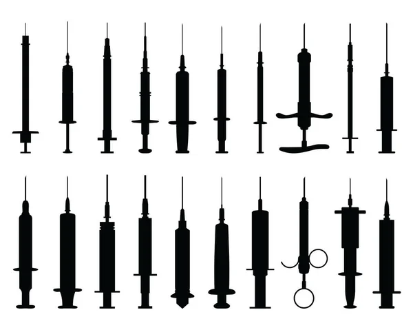 Black silhouettes of syringes on a white background