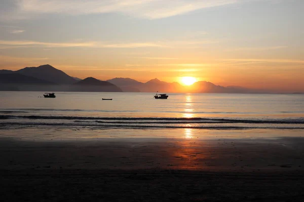 Golden winter sunrise at Itagua beach, Ubatuba, Brazil. High quality photo