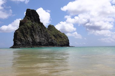 Cacimba do padre beach against two brothers hills on the background, at Fernando de Noronha, Pernambuco, Brazil, in a sunny winter day. High quality photo