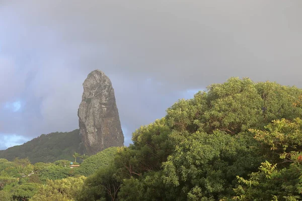 Morro do Pico rock in a cloudy day at Fernando de Noronha archipelago, Brazil.. High quality photo